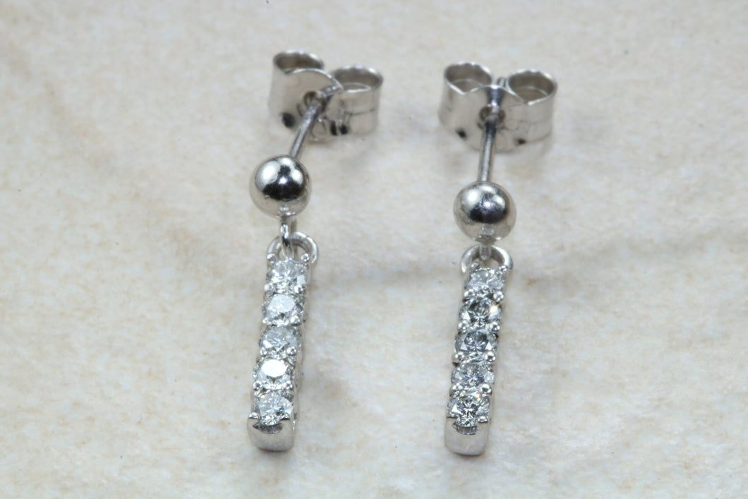 Diamond set dropper earrings. 18ct Gold with Latchback fittings.Perfect gift solution for any occasion. F VS1 grade Diamonds