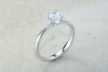 Load image into Gallery viewer, Forever One graded Charles and Colvard Mossainte set in this simple, elegant and timeless platinum solitaire