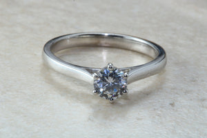 Elegant Charles and Colvard 1 carat Forever One graded Mossainte platinum solitaire