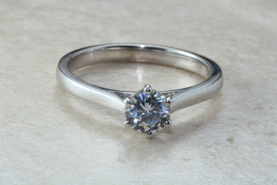 Elegant Charles and Colvard 1 carat Forever One graded Mossainte platinum solitaire