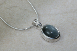 Natural Black Cats Eye pendant together with 16 inch long chain, 925 grade sterling silver, healing gemstones.