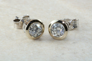 Elegant diamond solitaire stud earings,real round cut diamonds set in 18ct white gold, perfect for everyday wear.Ideal gift for any occasion