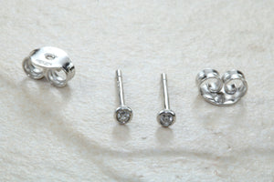 Very tiny and simple everyday diamond solitaire stud earings,natural round diamonds in white gold,no claws and very smooth to the touch
