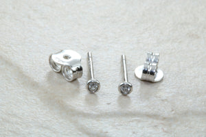 Very tiny and simple everyday diamond solitaire stud earings,natural round diamonds in white gold,no claws and very smooth to the touch