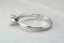 Load image into Gallery viewer, Forever One graded Charles and Colvard Mossainte set in this simple, elegant and timeless platinum solitaire