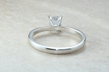 Load image into Gallery viewer, Forever One graded Charles and Colvard Mossainte set in this simple, elegant and timeless platinum solitaire