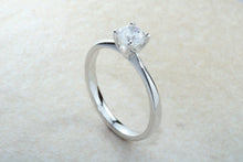 Load image into Gallery viewer, Forever One graded Charles and Colvard Mossainte set in this simple, elegant and timeless platinum solitaire