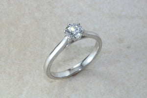 Elegant Charles and Colvard 1 carat Forever One graded Mossainte platinum solitaire