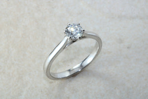 Elegant Charles and Colvard 1 carat Forever One graded Mossainte platinum solitaire