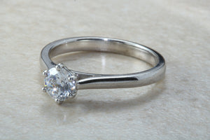 Elegant Charles and Colvard 1 carat Forever One graded Mossainte platinum solitaire