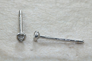 Very tiny and simple everyday diamond solitaire stud earings,natural round diamonds in white gold,no claws and very smooth to the touch