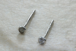 Very tiny and simple everyday diamond solitaire stud earings,natural round diamonds in white gold,no claws and very smooth to the touch