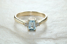 Load image into Gallery viewer, This combination of Diamond and blue Topaz trilogy ring is sure to be the gift of choice. solid 9ct yellow gold. Just the perfect gift