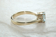 Load image into Gallery viewer, This combination of Diamond and blue Topaz trilogy ring is sure to be the gift of choice. solid 9ct yellow gold. Just the perfect gift