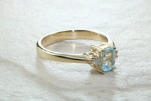 Load image into Gallery viewer, This combination of Diamond and blue Topaz trilogy ring is sure to be the gift of choice. solid 9ct yellow gold. Just the perfect gift