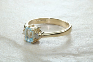 This combination of Diamond and blue Topaz trilogy ring is sure to be the gift of choice. solid 9ct yellow gold. Just the perfect gift