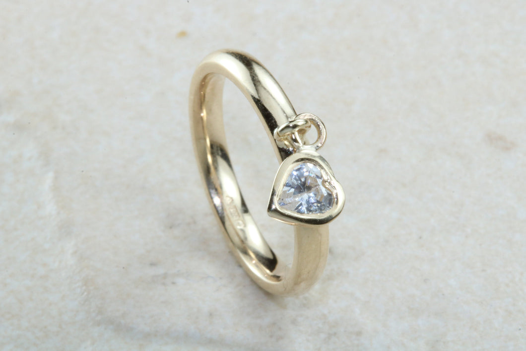 Petite yellow gold band with heart dropper, solid 9ct yellow gold and heart cubic zirconia. Perfect dress ring, ideal gift for any occasion