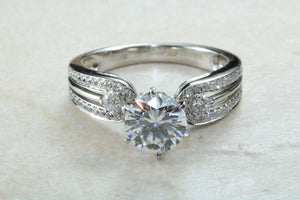 Stunning Charles and Colvard One carat Forever One Mossainte with natural diamonds set in this beautiful 18ct white gold ring