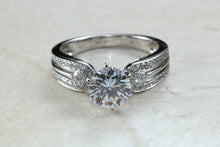 Load image into Gallery viewer, Stunning Charles and Colvard One carat Forever One Mossainte with natural diamonds set in this beautiful 18ct white gold ring