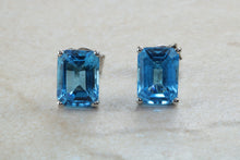 Load image into Gallery viewer, Natural Emerald cut blue Topaz stud earrings set in solid 9ct white gold