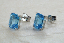 Load image into Gallery viewer, Natural Emerald cut blue Topaz stud earrings set in solid 9ct white gold
