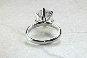 3 carat round Forever One Moissanite Diamond solitaire. Charles and Colvard 9.50 mm round set in classic 6 claw platinum engagement ring