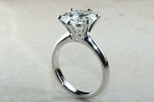 3 carat round Forever One Moissanite Diamond solitaire. Charles and Colvard 9.50 mm round set in classic 6 claw platinum engagement ring