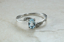 Load image into Gallery viewer, Blue topaz and diamond set twist ring. 9ct White gold with real diamonds and real topaz