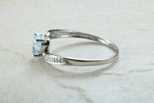 Load image into Gallery viewer, Blue topaz and diamond set twist ring. 9ct White gold with real diamonds and real topaz