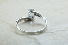 Load image into Gallery viewer, Blue topaz and diamond set twist ring. 9ct White gold with real diamonds and real topaz