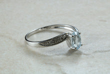 Load image into Gallery viewer, Blue topaz and diamond set twist ring. 9ct White gold with real diamonds and real topaz