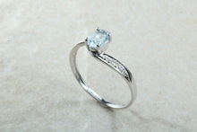 Load image into Gallery viewer, Blue topaz and diamond set twist ring. 9ct White gold with real diamonds and real topaz
