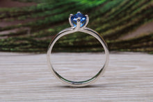 Load image into Gallery viewer, Silver solitaire ring with four claw twist setting of beautiful round royal blue sapphire C Z