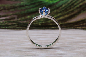 Silver solitaire ring with four claw twist setting of beautiful round royal blue sapphire C Z