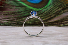 Load image into Gallery viewer, Silver solitaire ring with four claw twist setting of beautiful round royal blue sapphire C Z