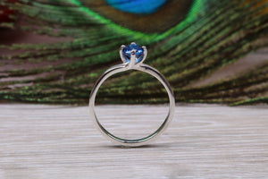 Silver solitaire ring with four claw twist setting of beautiful round royal blue sapphire C Z