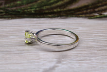 Load image into Gallery viewer, Silver solitaire twist style ring set with beautiful round Peridot C Z,ideal as promise, engagement or even dress ring.