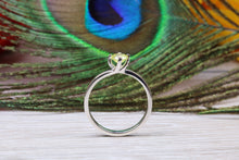 Load image into Gallery viewer, Silver solitaire twist style ring set with beautiful round Peridot C Z,ideal as promise, engagement or even dress ring.