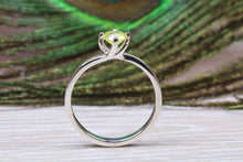 Load image into Gallery viewer, Silver solitaire twist style ring set with beautiful round Peridot C Z,ideal as promise, engagement or even dress ring.
