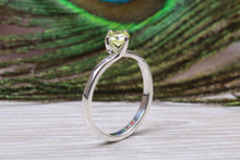 Load image into Gallery viewer, Silver solitaire twist style ring set with beautiful round Peridot C Z,ideal as promise, engagement or even dress ring.
