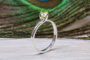Silver solitaire twist style ring set with beautiful round Peridot C Z,ideal as promise, engagement or even dress ring.
