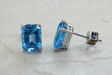 Load image into Gallery viewer, Natural Emerald cut blue Topaz stud earrings set in solid 9ct white gold