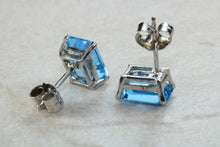 Load image into Gallery viewer, Natural Emerald cut blue Topaz stud earrings set in solid 9ct white gold