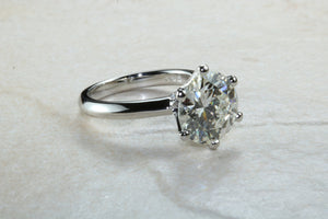 3 carat round Forever One Moissanite Diamond solitaire. Charles and Colvard 9.50 mm round set in classic 6 claw platinum engagement ring