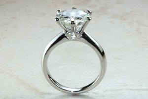3 carat round Forever One Moissanite Diamond solitaire. Charles and Colvard 9.50 mm round set in classic 6 claw platinum engagement ring