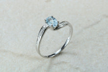 Load image into Gallery viewer, Blue topaz and diamond set twist ring. 9ct White gold with real diamonds and real topaz