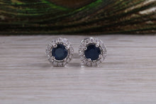 Load image into Gallery viewer, One carat each Blue Sapphire and Diamond Halo set Earrings