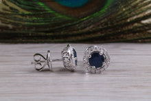Load image into Gallery viewer, One carat each Blue Sapphire and Diamond Halo set Earrings