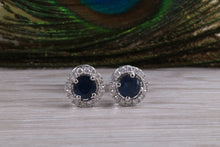 Load image into Gallery viewer, One carat each Blue Sapphire and Diamond Halo set Earrings