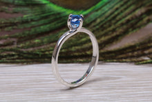 Load image into Gallery viewer, Silver solitaire ring with four claw twist setting of beautiful round royal blue sapphire C Z